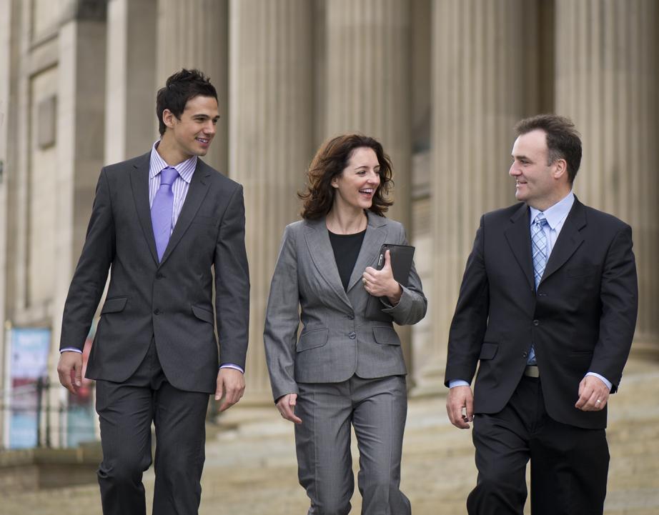 Graduate Students walking down the steps of a legal building