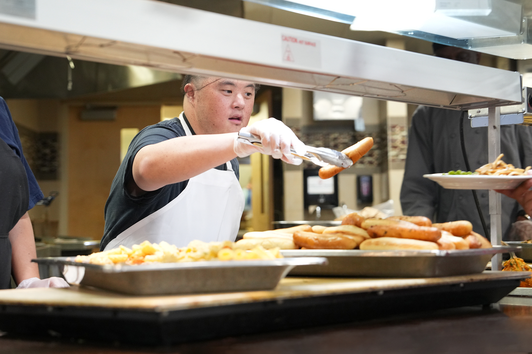 Member from The Arc working in Daly Dining Hall